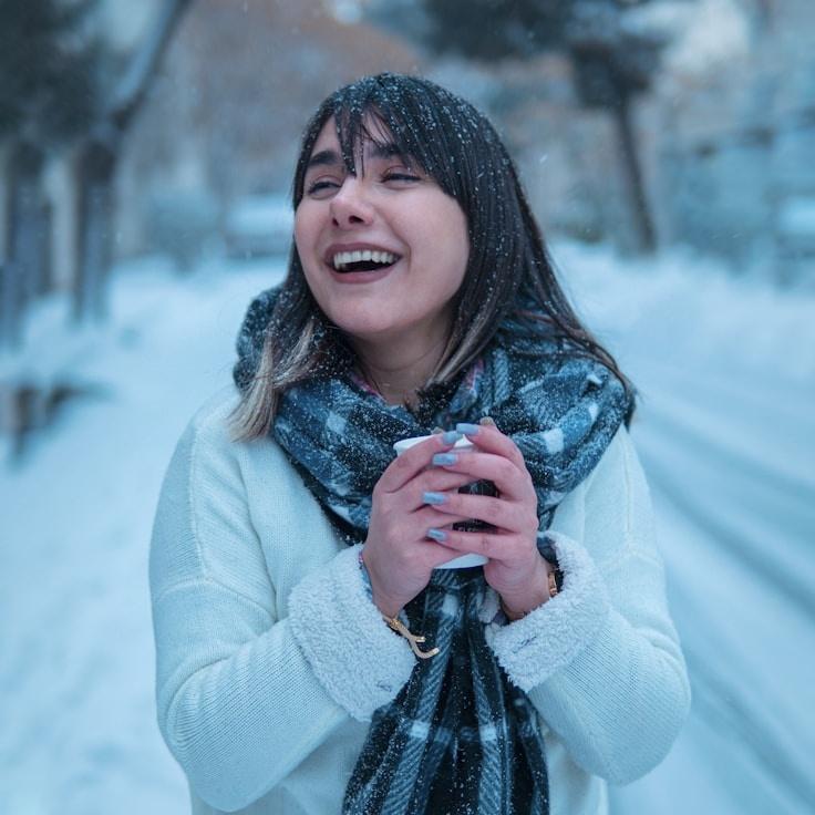 Avery Singh, Lead Design Curator at Island Glade Home, reviewing corporate floral arrangements